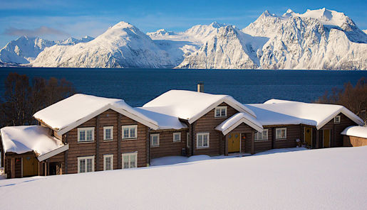 Lyngen Lodge in winter with a view of the mountains, Norway