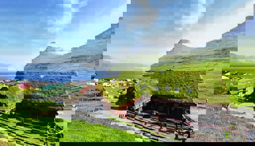 Summer view of Gjaargardur Guesthouse in the Faroe Islands