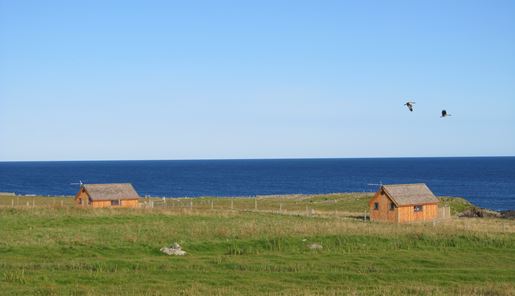 The Hebridean Huts on a sunny day overlooking the ocean on the Isle of Lewis in the Outer Hebrides in Scotland